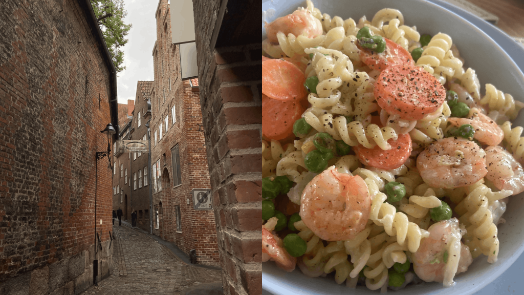 Das Bild zeigt eine Gasse in der Altstadt Lübeck bei Jan's Workation und nebendran einen Teller Nudeln mit Shrimps